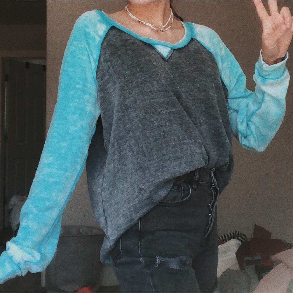 faded light blue and grey sweater